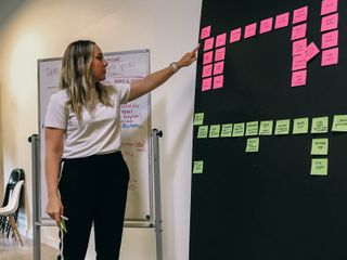 Lindsay Rife gesturing at a card sort exercise