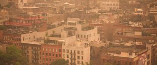 East-facing view of Manhattan’s Soho neighborhood under orange-tinted sky